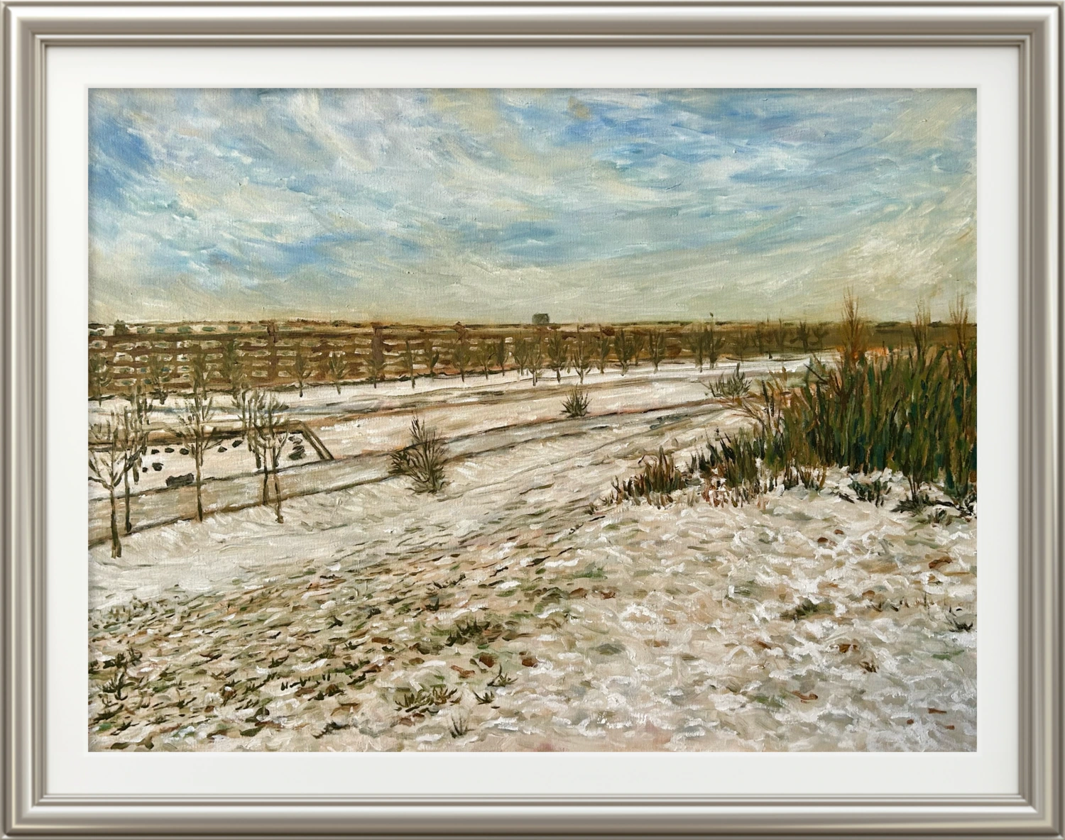 A winter landscape of Mauerpark in Berlin, with bare trees beneath a pale sky.